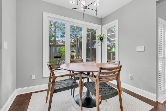 8 Pony Ln, Charleston, SC 29407 - dining space featuring baseboards, wood finished floors, and a chandelier