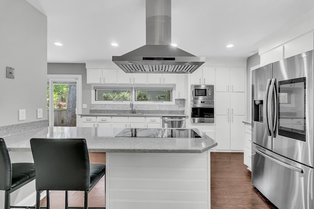 8 Pony Ln, Charleston, SC 29407 - kitchen featuring appliances with stainless steel finishes, exhaust hood, a sink, white cabinetry, and a peninsula