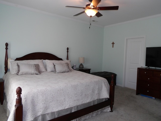 carpeted bedroom featuring ceiling fan and ornamental molding