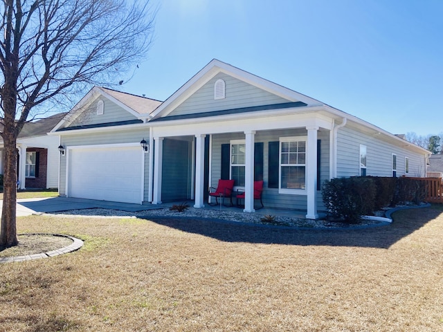 view of front facade featuring a garage, concrete driveway, covered porch, and a front yard