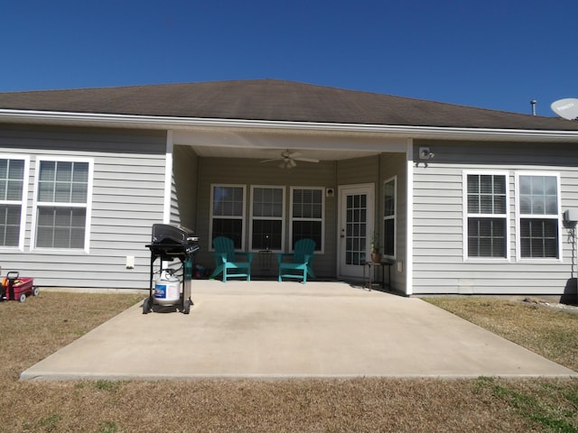 back of house with a ceiling fan and a patio