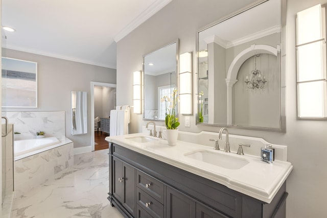 bathroom with ornamental molding, vanity, and tiled bath