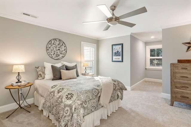 bedroom featuring light carpet, ceiling fan, and crown molding