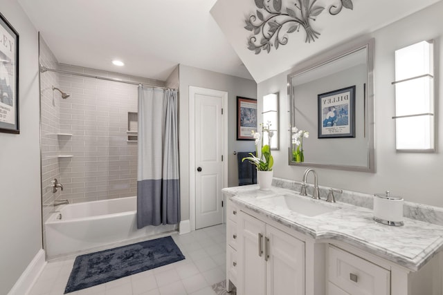 bathroom featuring tile patterned floors, lofted ceiling, vanity, and shower / bath combo with shower curtain