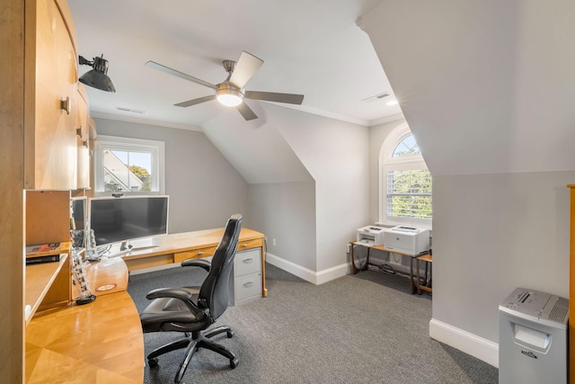 carpeted office space with a wealth of natural light, ceiling fan, crown molding, and lofted ceiling