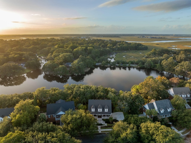 aerial view at dusk with a water view