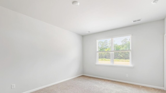 54 Twickenham Loop, Yemassee, SC 29945 - empty room with light colored carpet and a smoke detector
