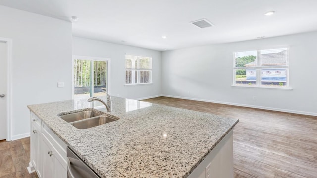 54 Twickenham Loop, Yemassee, SC 29945 - kitchen featuring plenty of natural light, light wood-style floors, white cabinetry, an island with sink, and recessed lighting