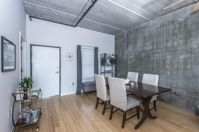 dining space with light hardwood / wood-style floors