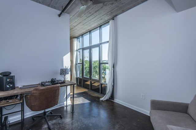 office with a high ceiling and ceiling fan