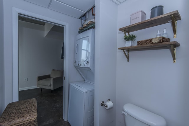 laundry room featuring stacked washer / dryer