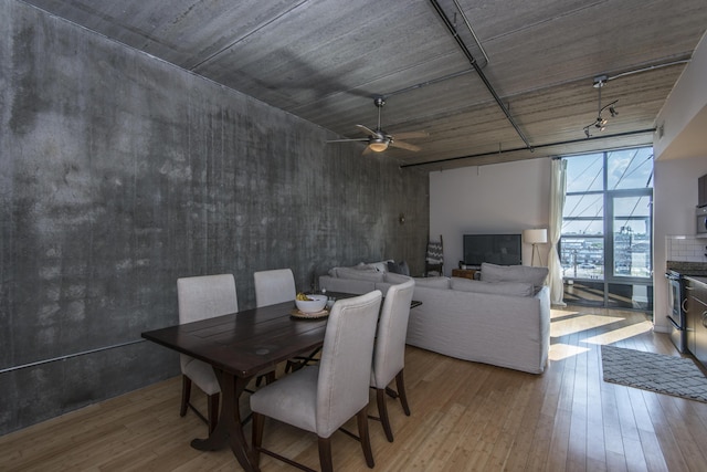 dining area featuring light hardwood / wood-style floors and ceiling fan