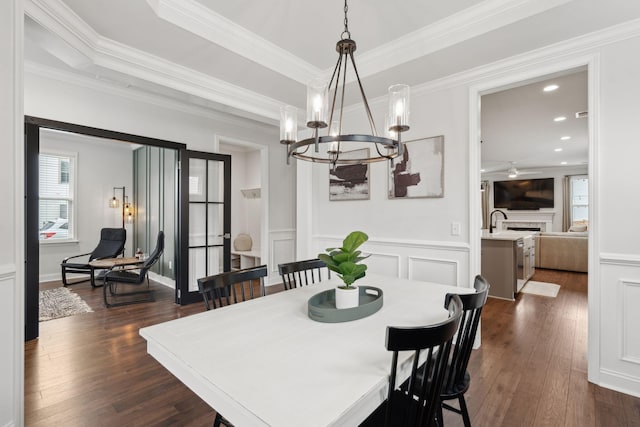 2267 Kemmerlin St, Johns Island, SC 29455 - dining area with a chandelier, dark wood finished floors, ornamental molding, a decorative wall, and recessed lighting