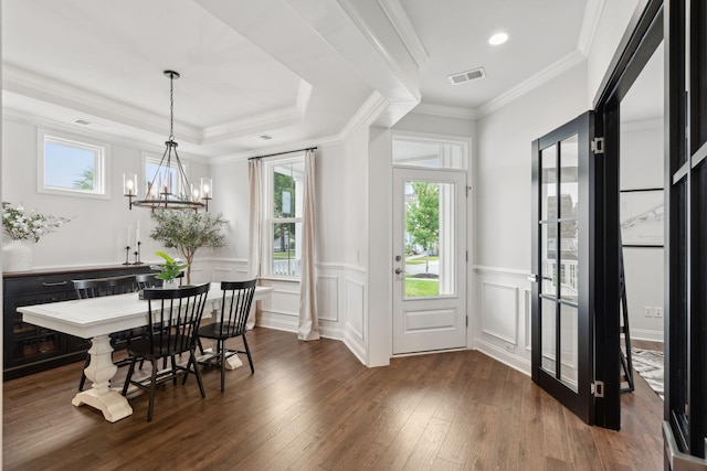 2267 Kemmerlin St, Johns Island, SC 29455 - dining space featuring dark wood-type flooring, a wainscoted wall, a chandelier, ornamental molding, and a decorative wall