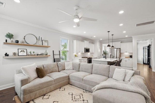 2267 Kemmerlin St, Johns Island, SC 29455 - living area featuring crown molding, ceiling fan, dark wood finished floors, and recessed lighting