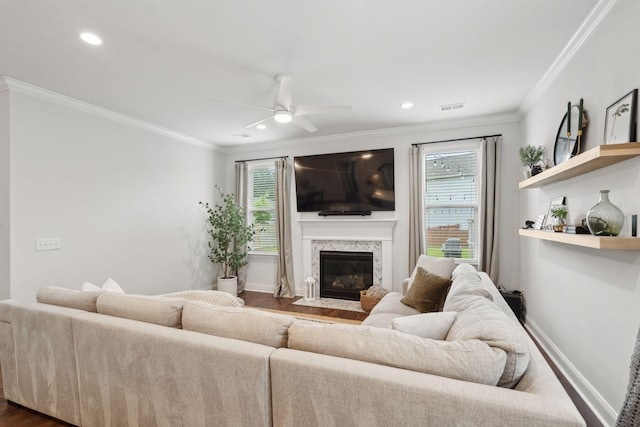2267 Kemmerlin St, Johns Island, SC 29455 - living room featuring dark wood-style floors, ornamental molding, plenty of natural light, ceiling fan, and a high end fireplace