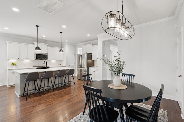 2267 Kemmerlin St, Johns Island, SC 29455 - dining space with crown molding, recessed lighting, and dark wood-type flooring