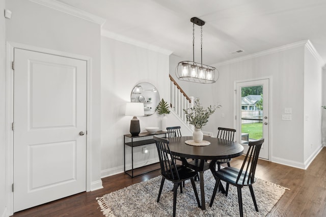 2267 Kemmerlin St, Johns Island, SC 29455 - dining room with ornamental molding, dark wood finished floors, stairs, and a chandelier