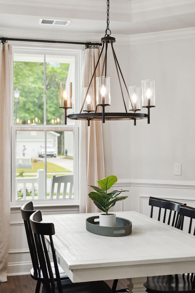 2267 Kemmerlin St, Johns Island, SC 29455 - dining area with a chandelier, dark wood-type flooring, a wainscoted wall, and ornamental molding
