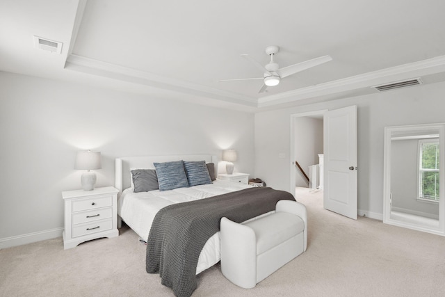 2267 Kemmerlin St, Johns Island, SC 29455 - bedroom featuring a tray ceiling, light colored carpet, ornamental molding, and a ceiling fan