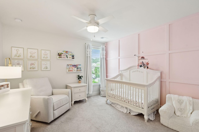 2267 Kemmerlin St, Johns Island, SC 29455 - bedroom with light colored carpet, a nursery area, and ceiling fan