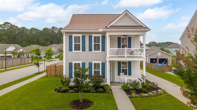 2267 Kemmerlin St, Johns Island, SC 29455 - view of front facade with covered porch, a balcony, ceiling fan, driveway, and roof with shingles