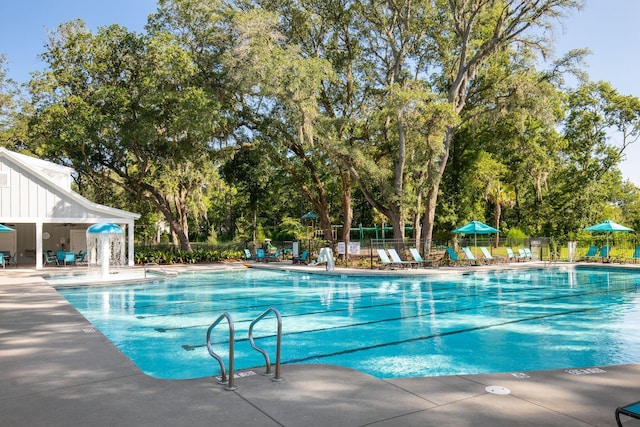 2267 Kemmerlin St, Johns Island, SC 29455 - community pool featuring a patio and view of wooded area