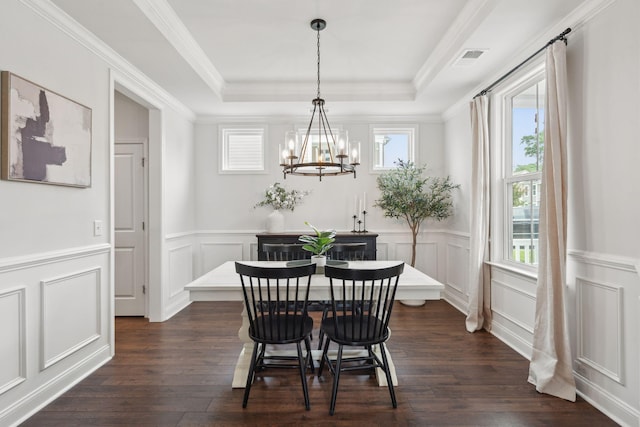 2267 Kemmerlin St, Johns Island, SC 29455 - dining room with a chandelier, healthy amount of natural light, a decorative wall, dark wood-style flooring, and a raised ceiling