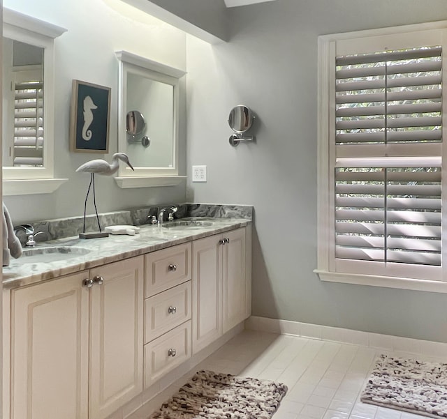 2655 Gnarled Pne, Seabrook Island, SC 29455 - bathroom with double vanity, tile patterned flooring, and baseboards