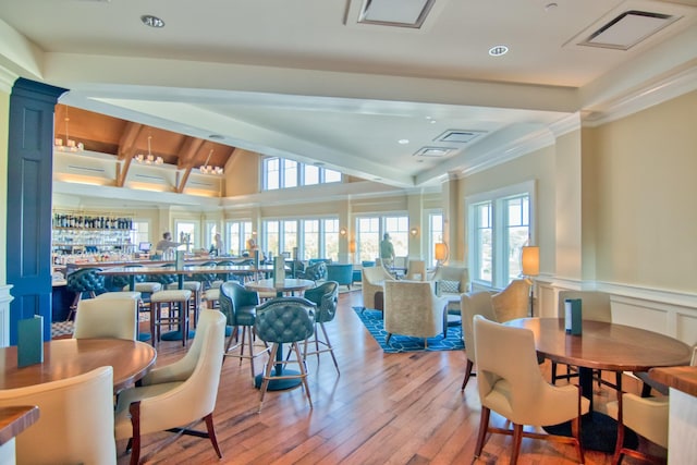 2655 Gnarled Pne, Seabrook Island, SC 29455 - dining area with hardwood / wood-style flooring, lofted ceiling, recessed lighting, and wainscoting