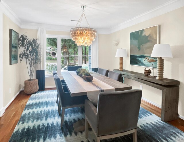 2655 Gnarled Pne, Seabrook Island, SC 29455 - dining space with a chandelier, wood finished floors, ornamental molding, and baseboards