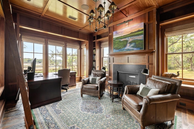 4855 Retriever Rd, Wadmalaw Island, SC 29487 - sitting room featuring wood ceiling, a chandelier, wood walls, an office area, and a tiled fireplace