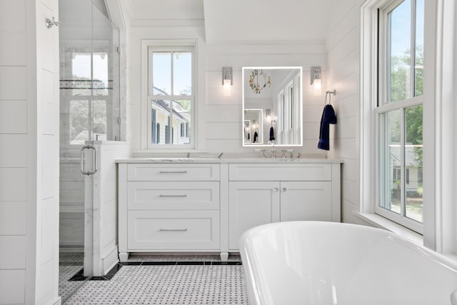 4855 Retriever Rd, Wadmalaw Island, SC 29487 - full bath with vanity, a stall shower, a freestanding tub, and tile patterned floors