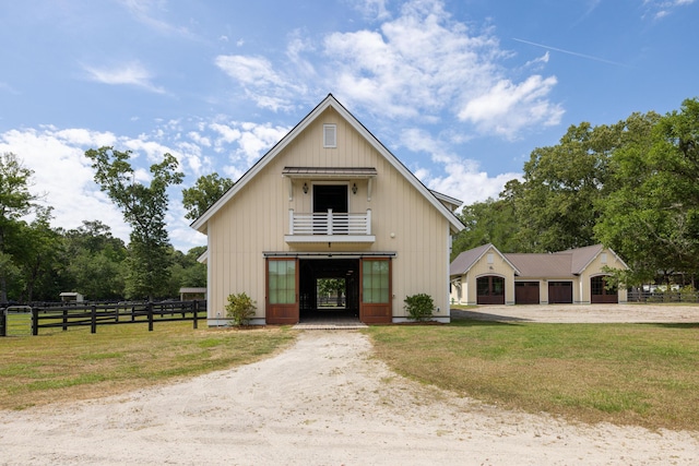4855 Retriever Rd, Wadmalaw Island, SC 29487 - view of front of property with driveway, board and batten siding, and a balcony