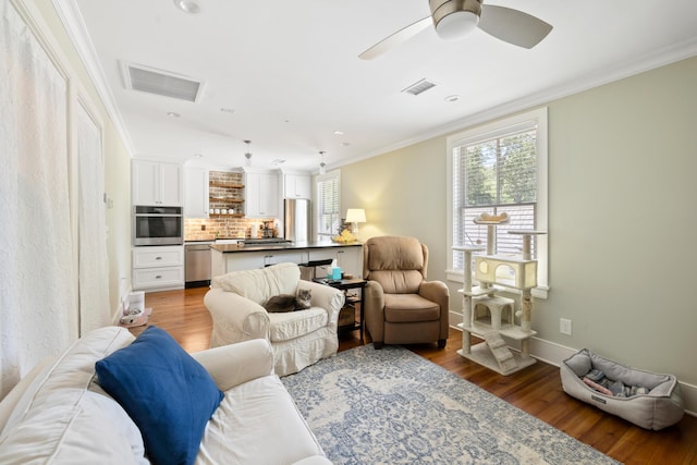 4855 Retriever Rd, Wadmalaw Island, SC 29487 - living room with ornamental molding, wood finished floors, ceiling fan, recessed lighting, and baseboards