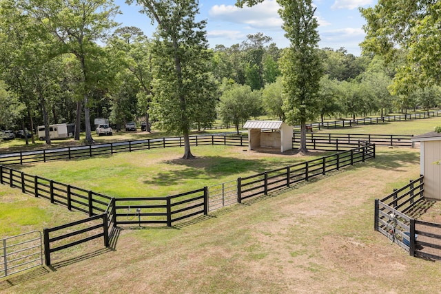 4855 Retriever Rd, Wadmalaw Island, SC 29487 - view of green lawn featuring an outdoor structure, an exterior structure, and a view of countryside