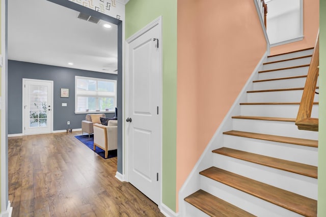 stairway featuring hardwood / wood-style flooring