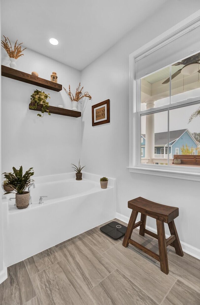 bathroom featuring a tub to relax in