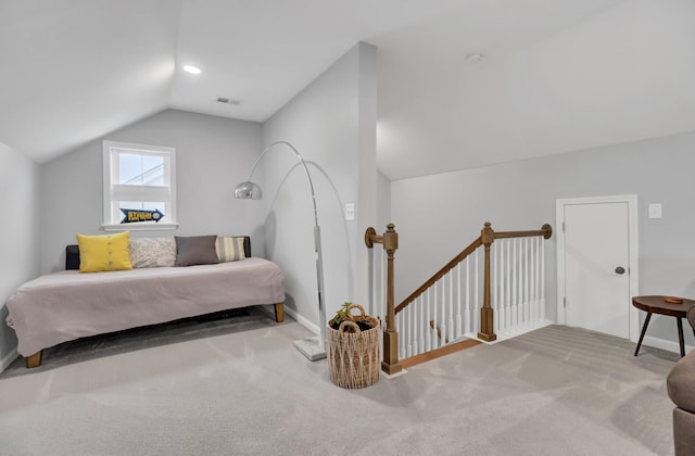 bedroom featuring carpet and lofted ceiling