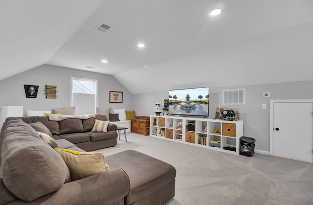 carpeted living room with vaulted ceiling