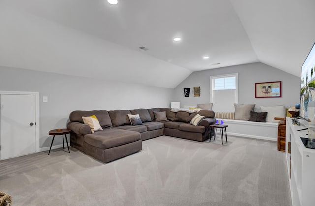 carpeted living room featuring lofted ceiling