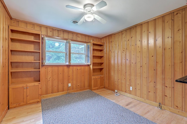 4729 Lang Ridge Dr, North Charleston, SC 29405 - empty room with light wood finished floors, ceiling fan, wooden walls, and baseboards