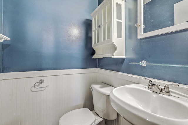 4729 Lang Ridge Dr, North Charleston, SC 29405 - bathroom featuring a wainscoted wall, a sink, and toilet