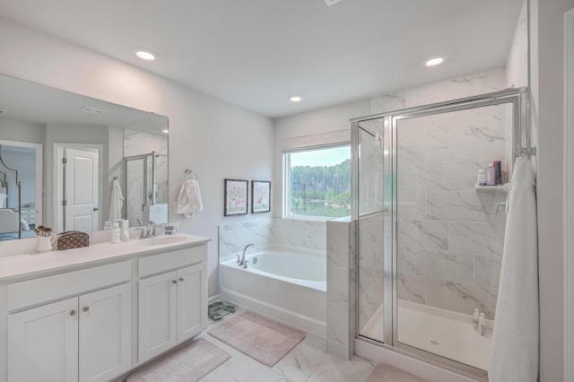 bathroom with plus walk in shower and vanity