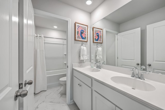 full bathroom with vanity, shower / tub combo with curtain, and toilet