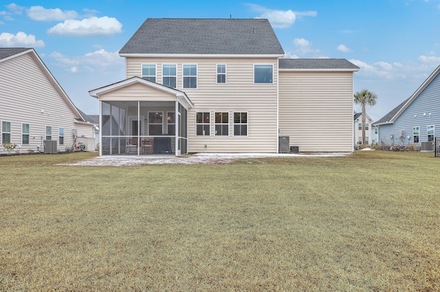 back of house with a patio, a sunroom, a yard, and central AC unit