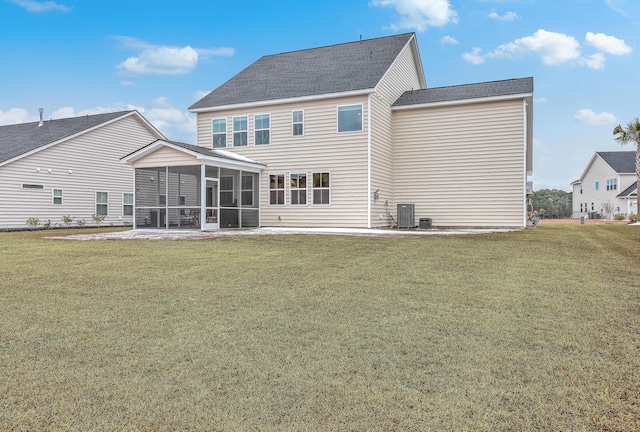 back of property featuring a yard, a patio area, a sunroom, and central air condition unit