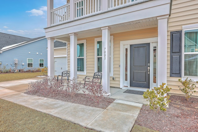 doorway to property featuring covered porch