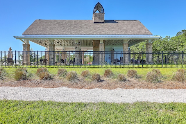 back of house with a yard