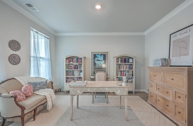 office space featuring crown molding and light hardwood / wood-style flooring